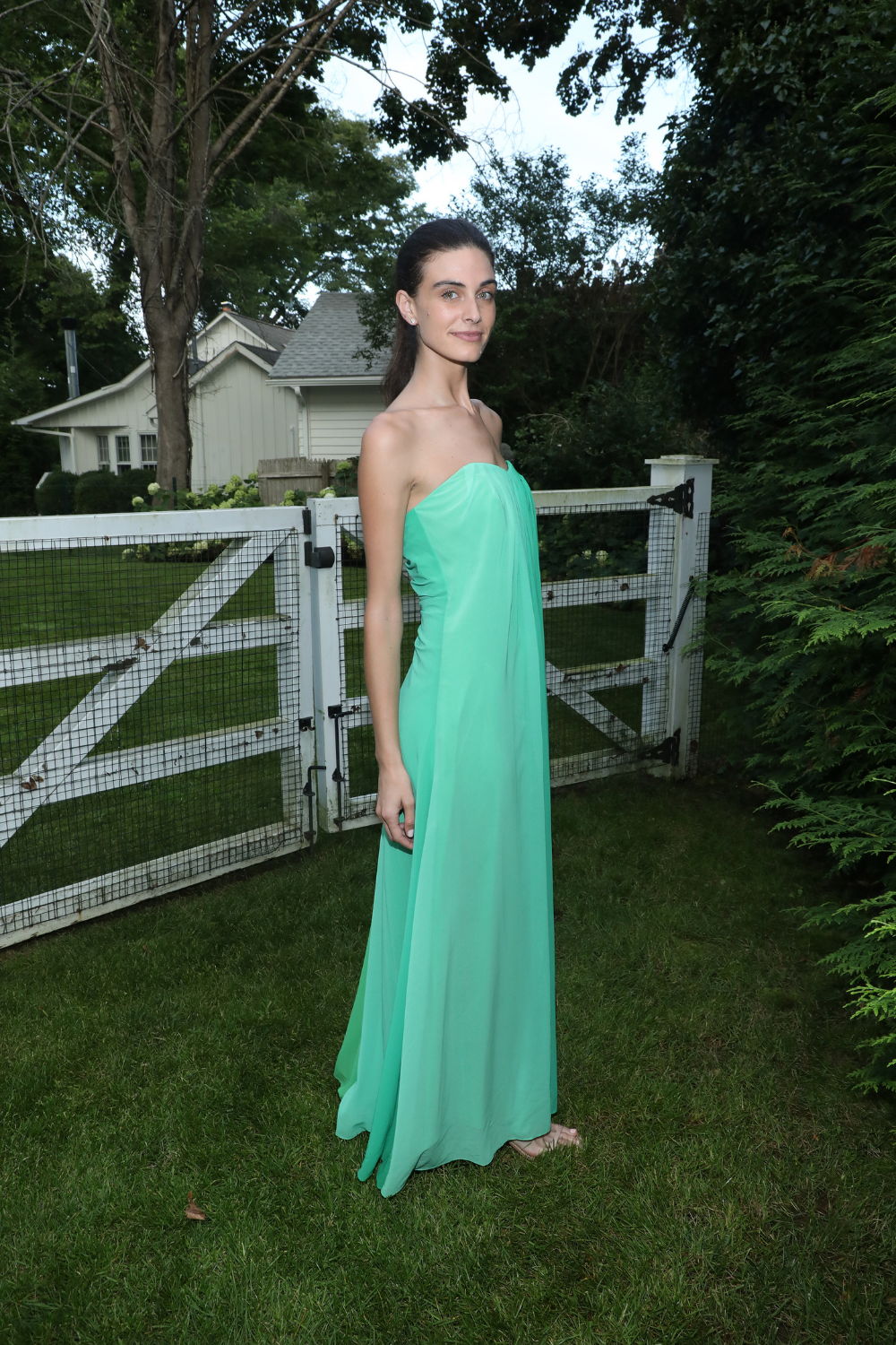 Wearing the Sunset Stripe Dress at MILLY x The Daily Front Row's Maidstone Hamptons Cocktail Party.