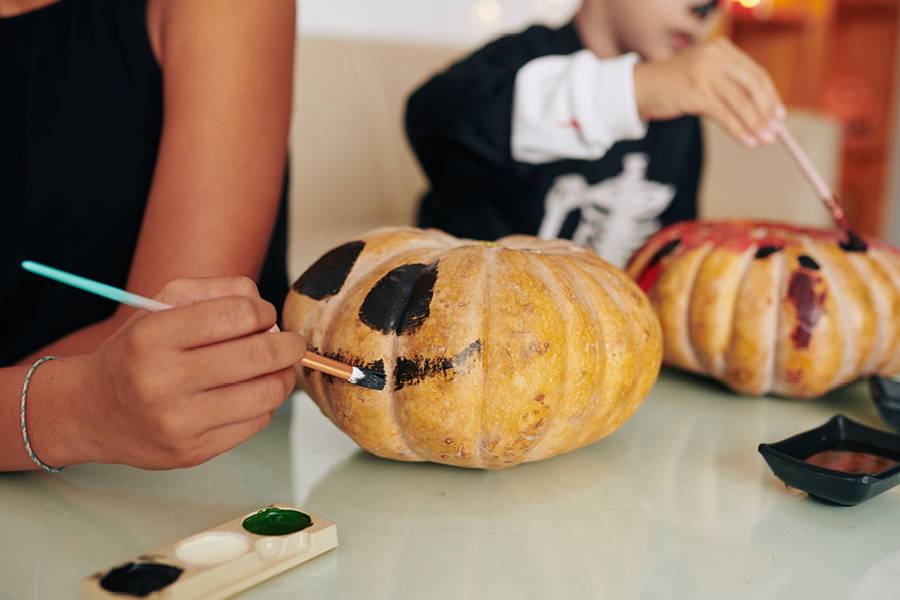 Halloween pumpkins being painted