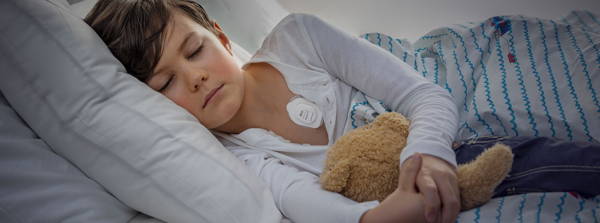Clinical application shot of child with Radius T sensor applied to chest