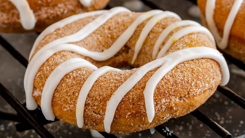 close up of cinnamon sugar donut with icing drizzle