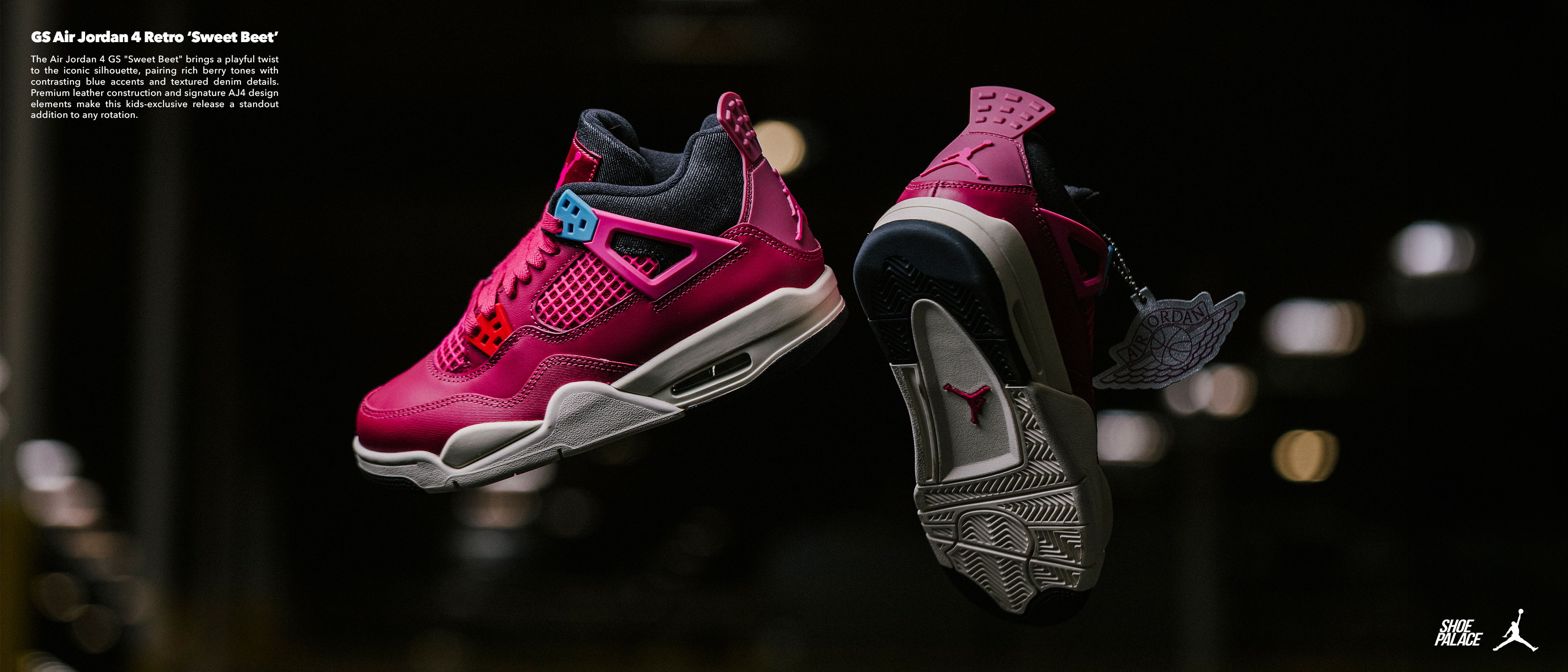 A pair of pink and black sneakers displayed in mid-air.
