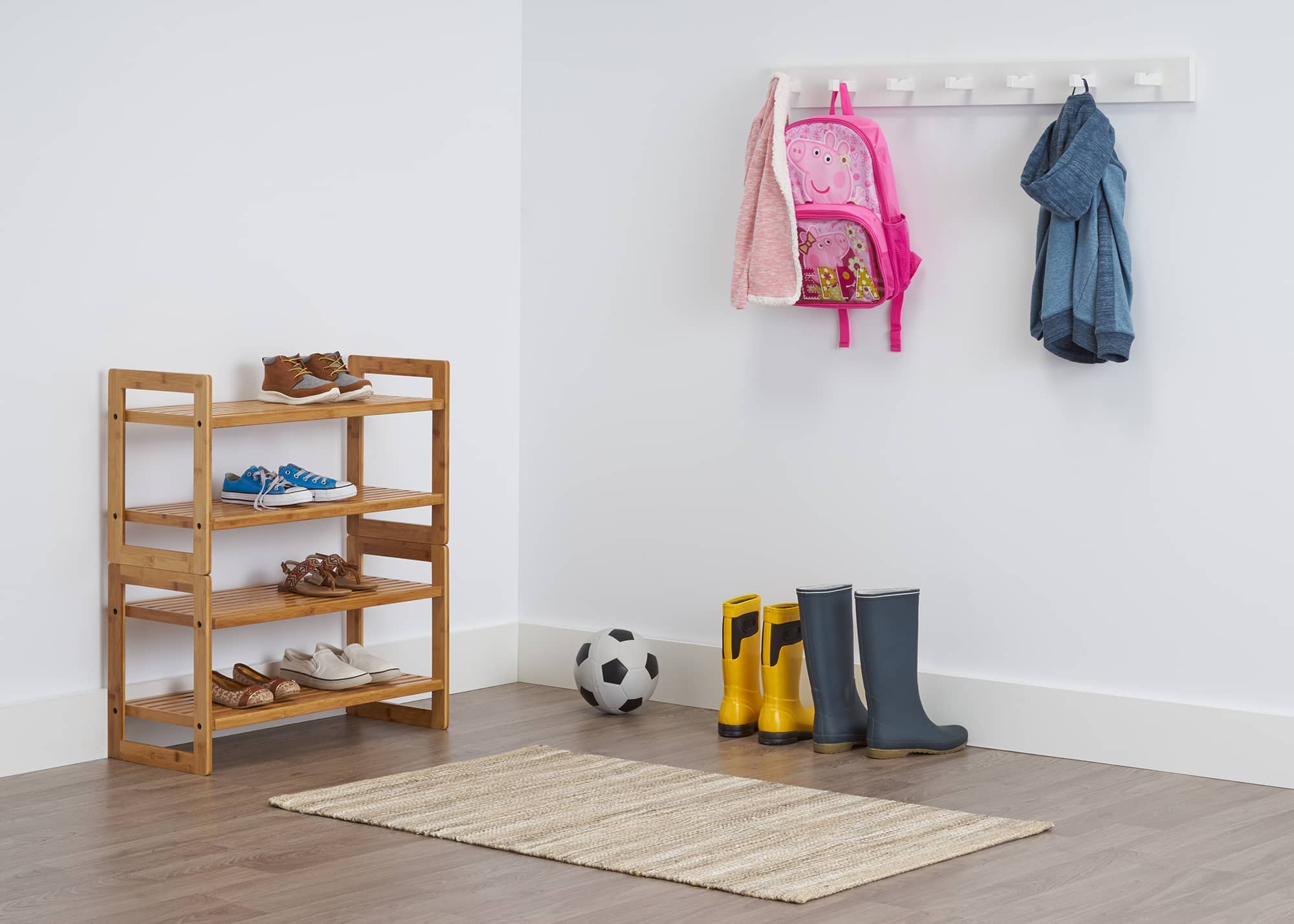 two stacked bamboo shoe rack used in an entry way