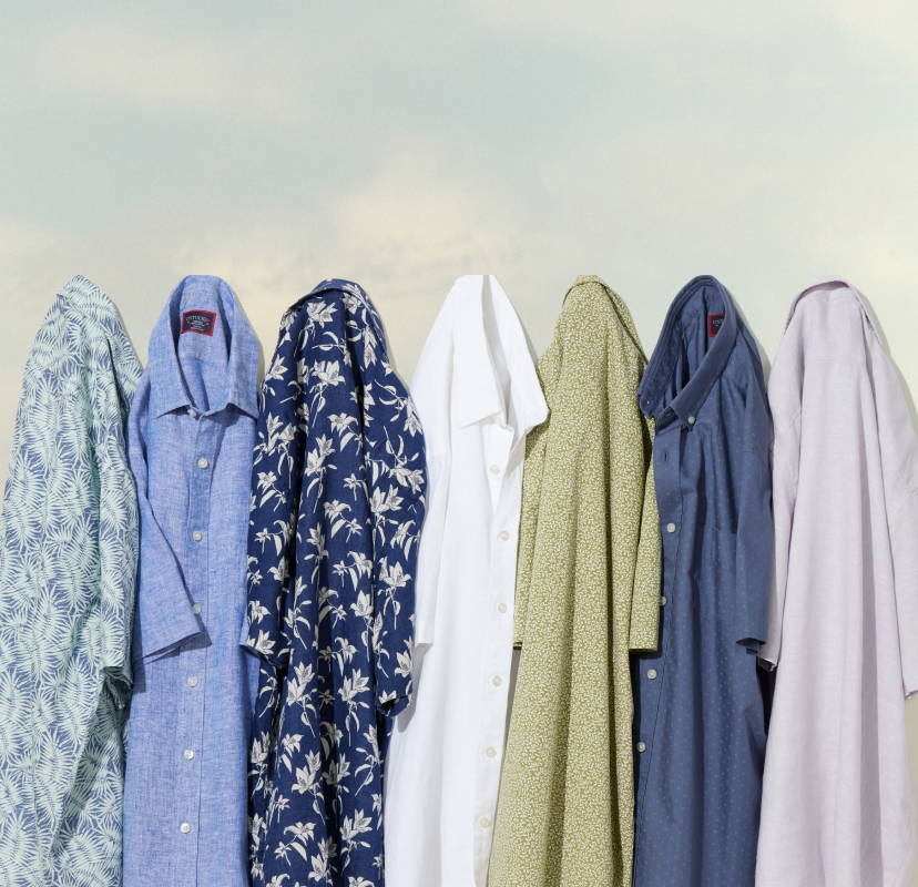 Collection of UNTUCKit wrinkle-resistant linen shirts in various colors. 