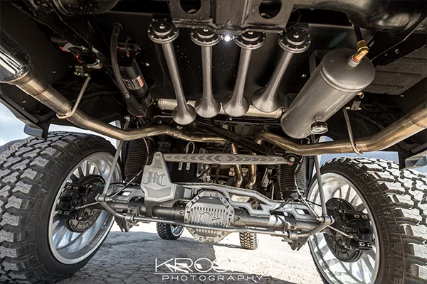 Rear undercarriage shot of train horns and air tank with custom suspension on a lifted Dodge Ram 1500