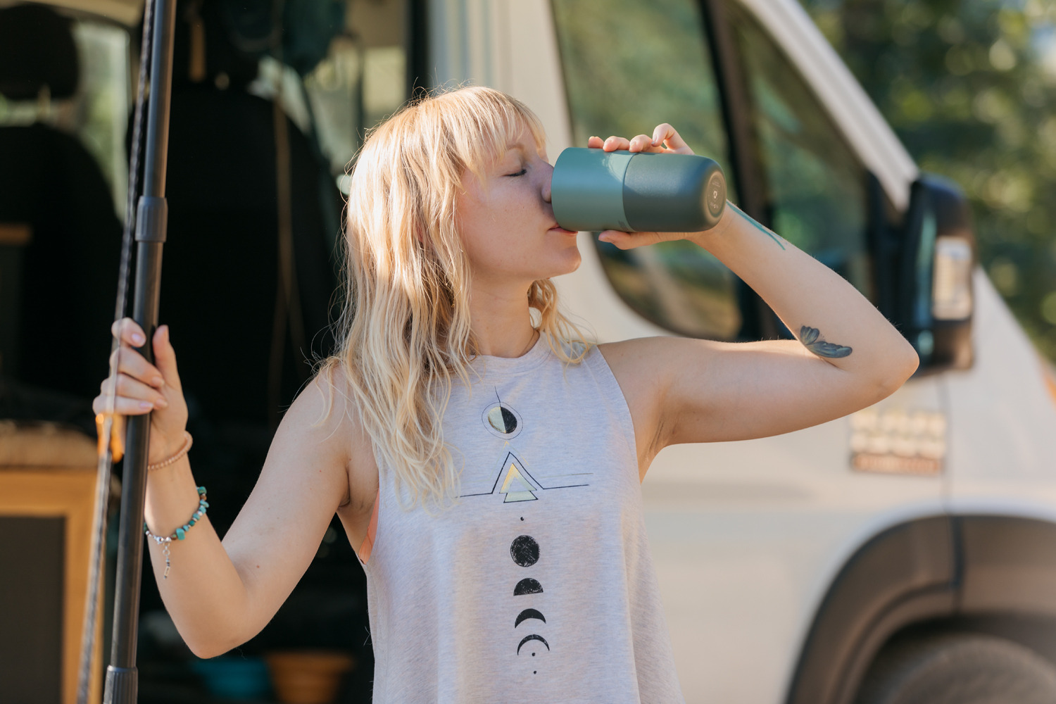 Girl drinking from rise tumbler