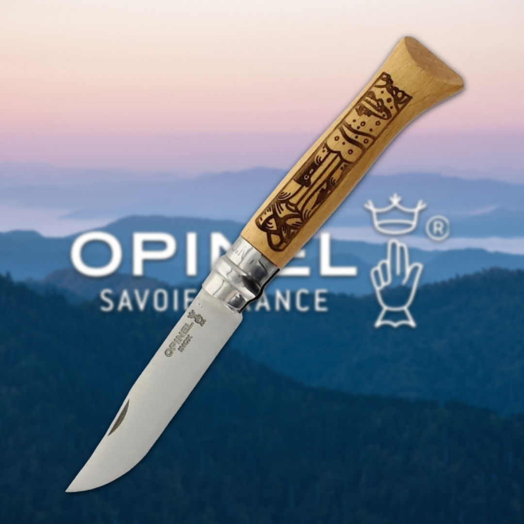 Opinel knife with a wooden handle against a scenic mountain background.