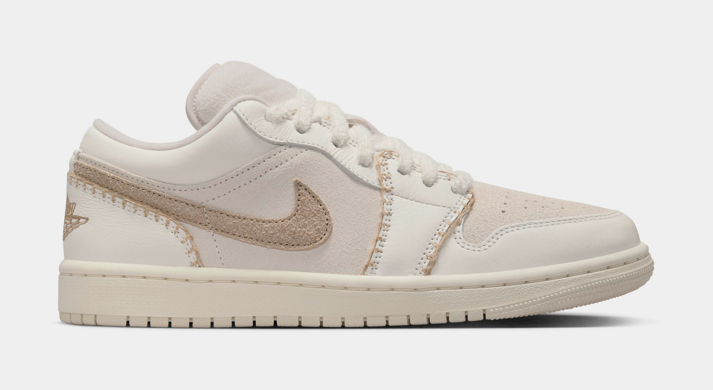 Nike Air Jordan 1 Low in beige and cream colorway.
