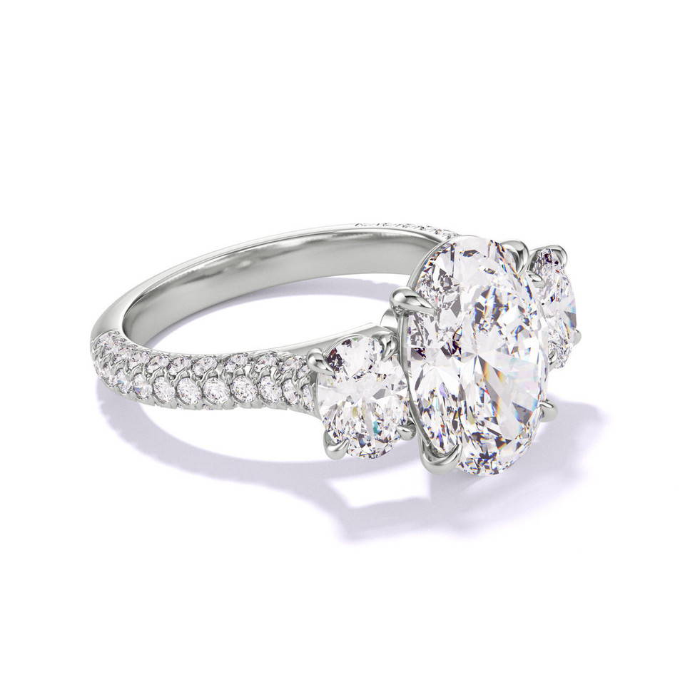 oval cut three stone engagement ring