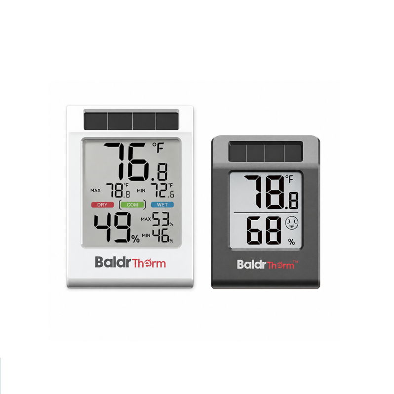 Two digital thermometers displaying temperature and humidity readings.