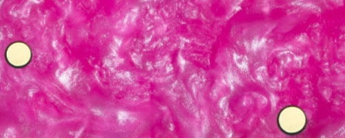 Abstract pink background with two circular yellow shapes.