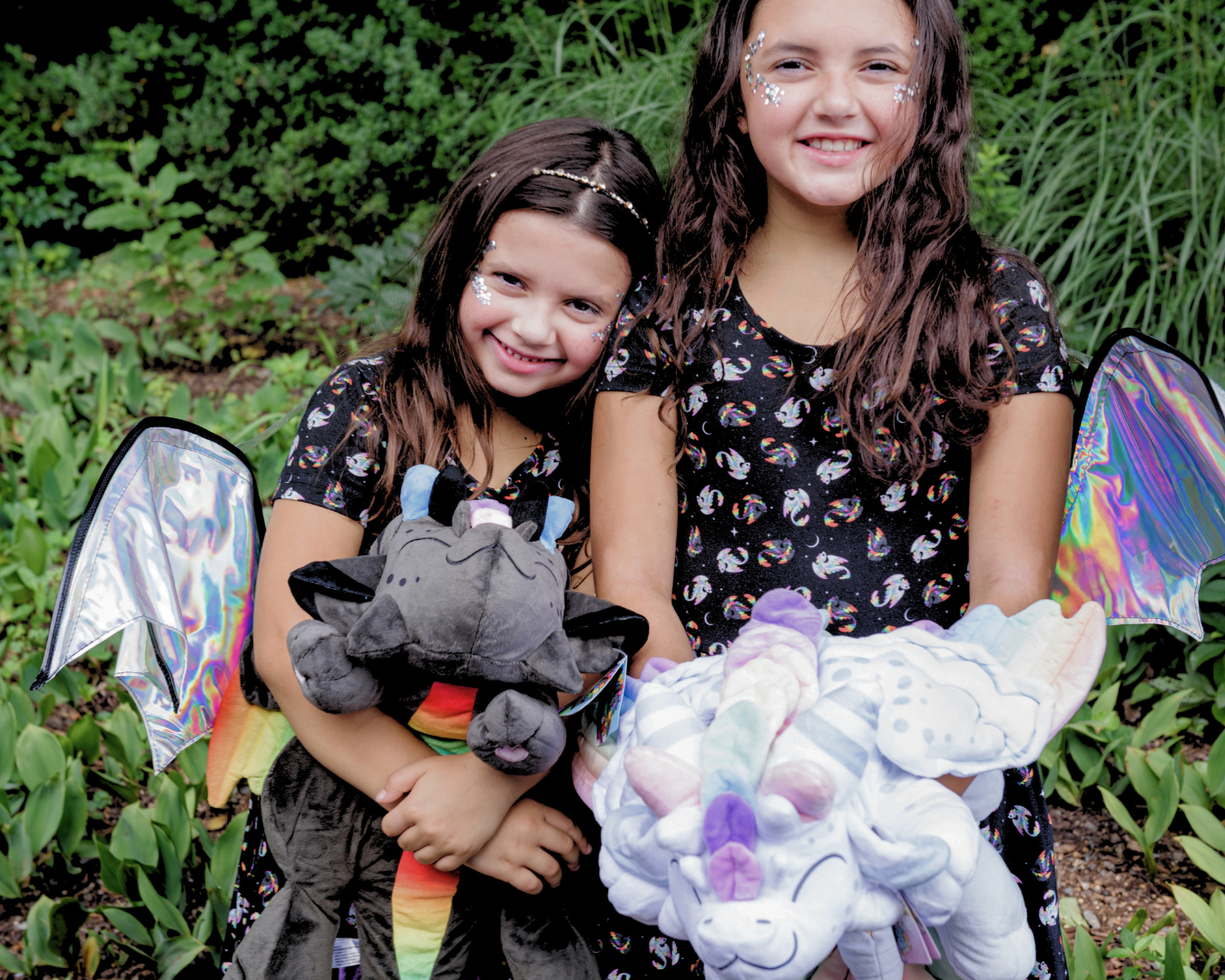 Kids in twirl dresses holding Zen and Harmony dragons