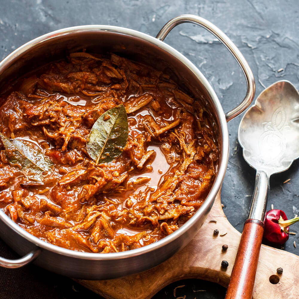 bay leaf in beef raju in metal pot with spoon