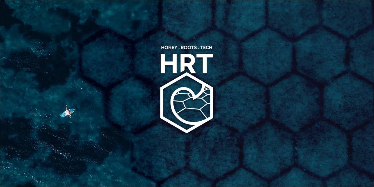 Graphic HRT Logo and person surfing in the ocean