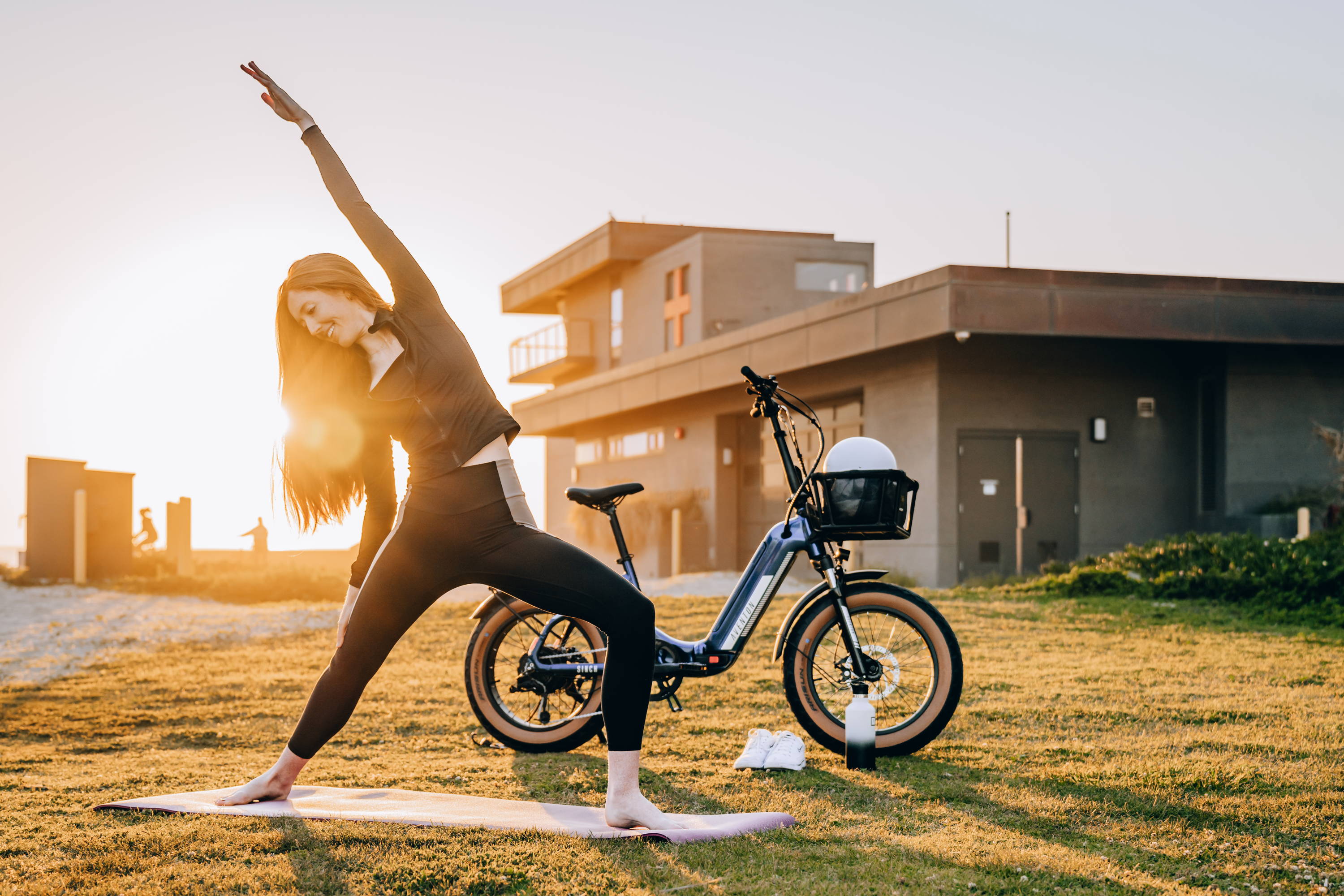 woman doing yoga next to aventon sinch.2