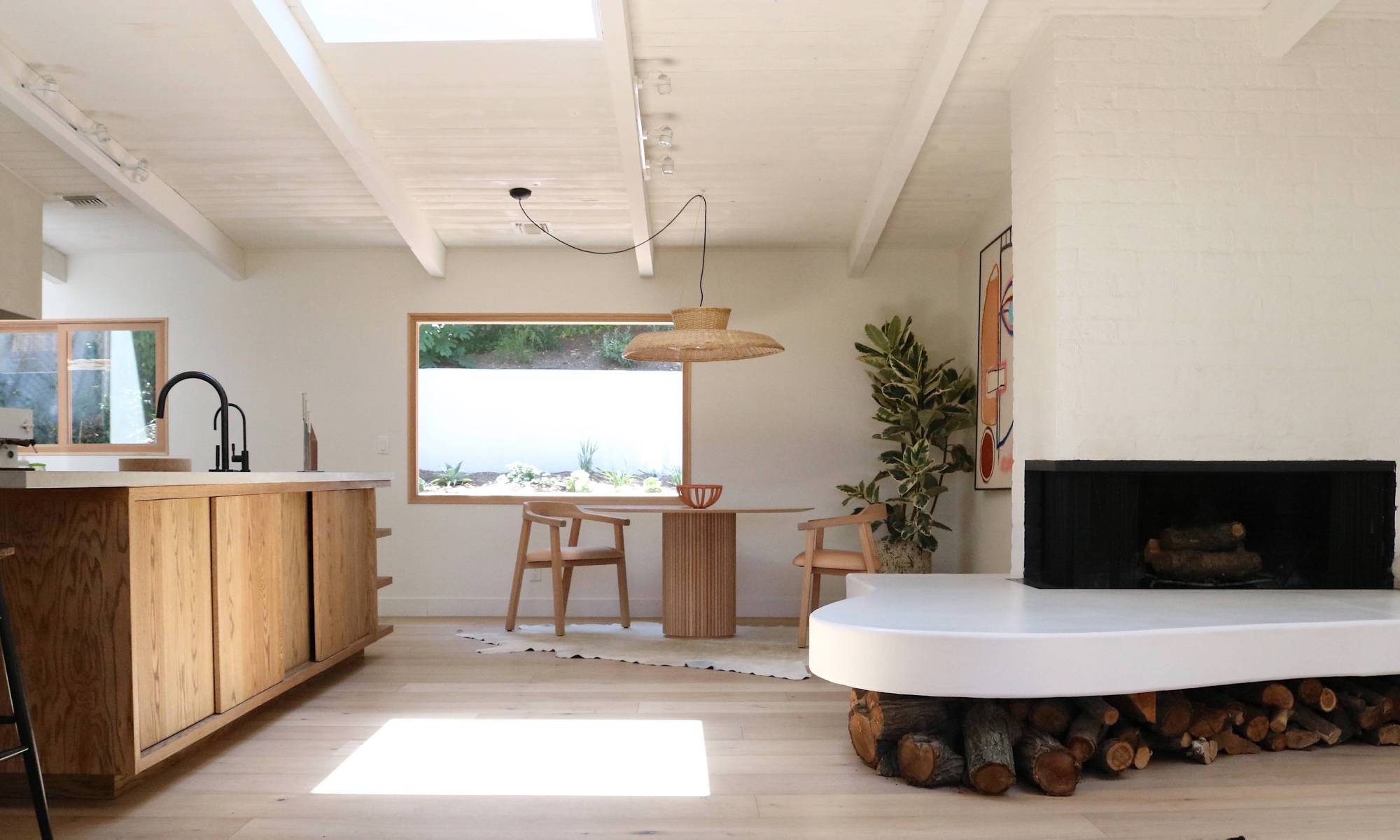 Kitchen with breakfast nook, circular table and wide fireplace