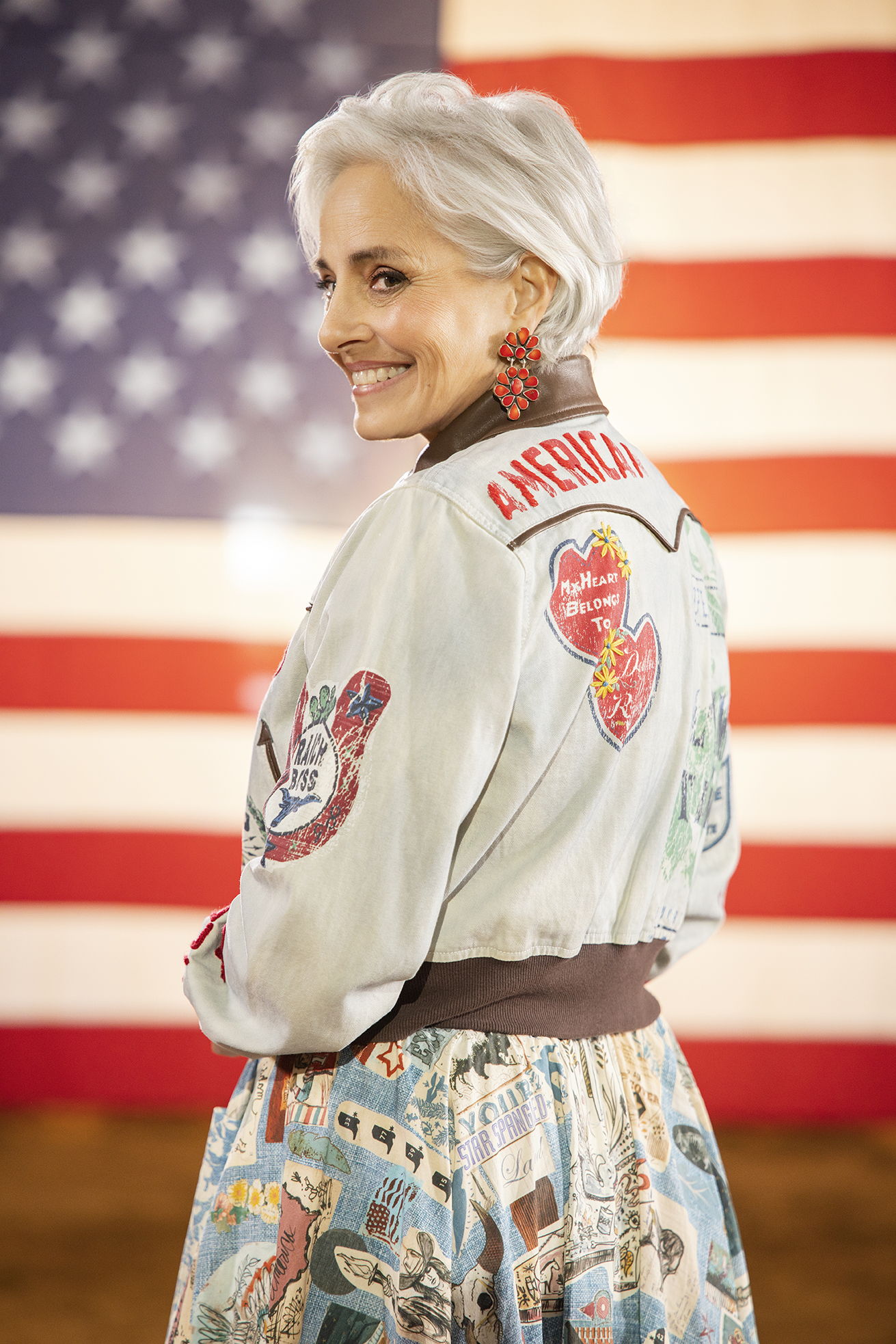 Hedy wearing the Honor Roll Jacket with the Sea to Shining Sea skirt with stunning Oscar Betz earring.
