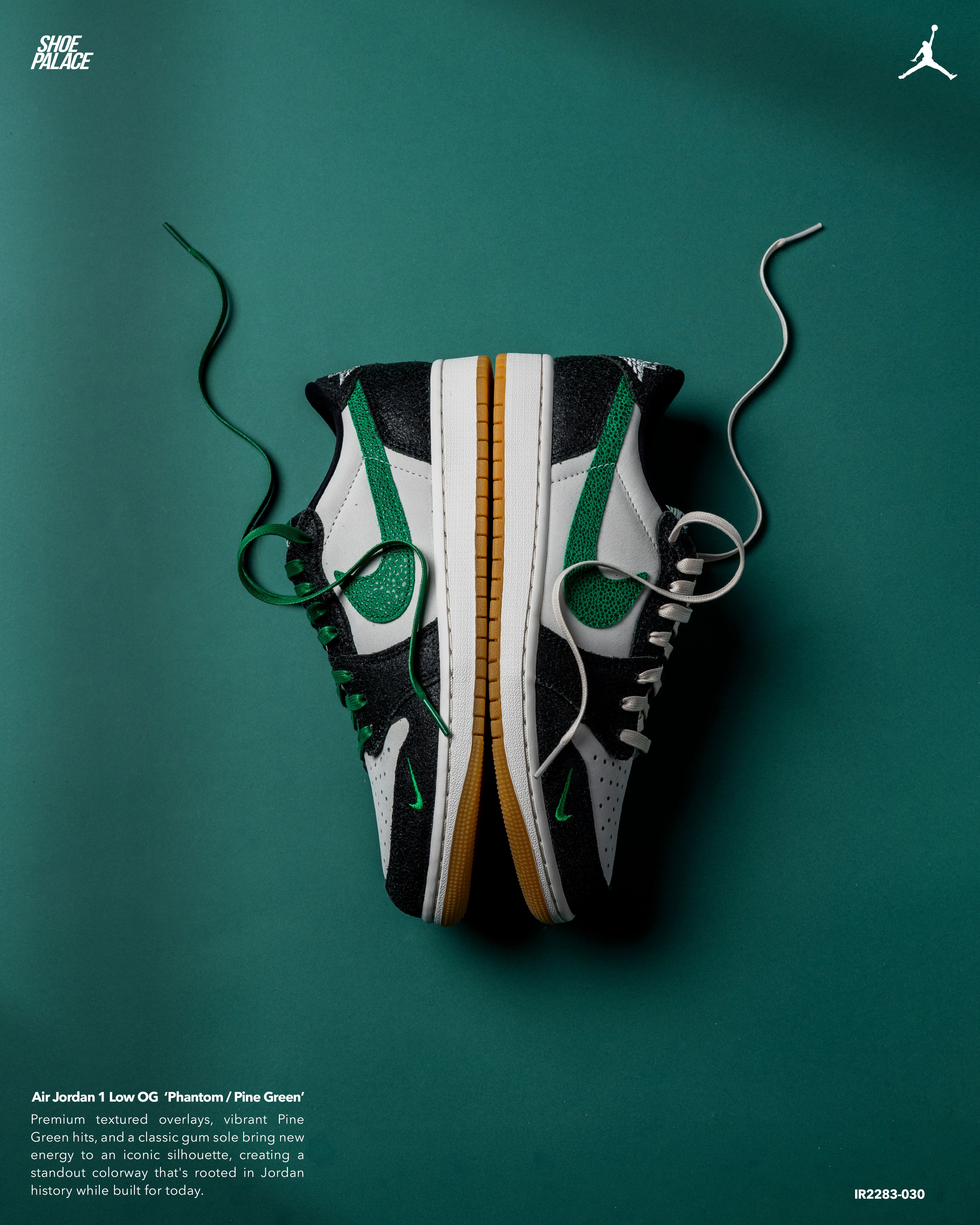 A pair of sneakers displayed on a green background with laces.