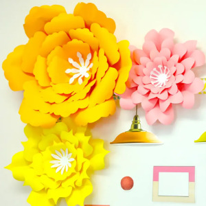 Classroom wall decorated with 3d flower accents.