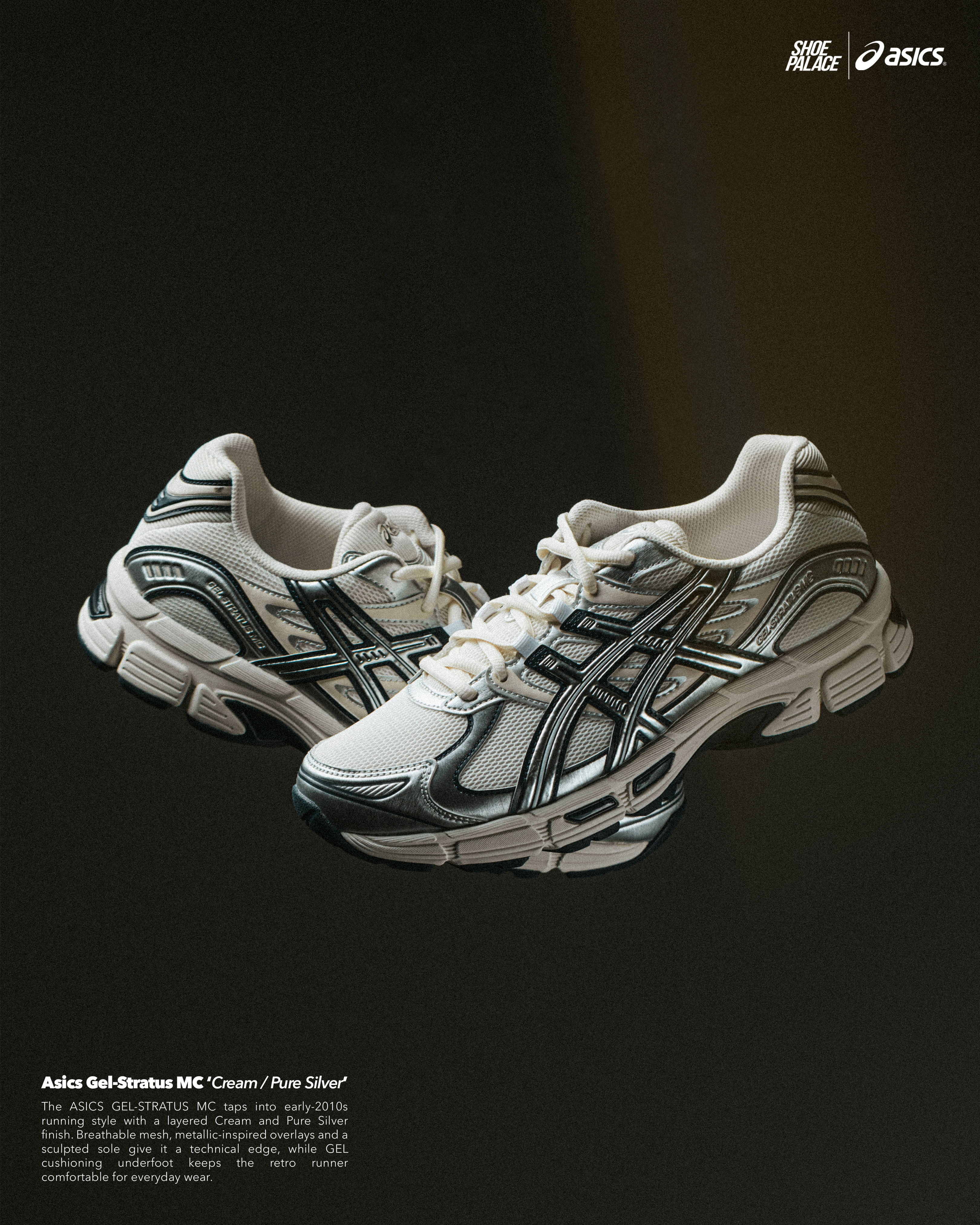 White and silver Asics running shoes on a dark background.