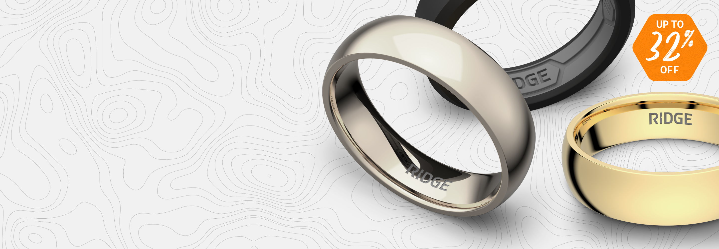 Two wedding rings, one silver and one gold, on a light background.