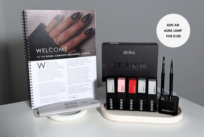 Display of nail polish products with a welcome booklet.
