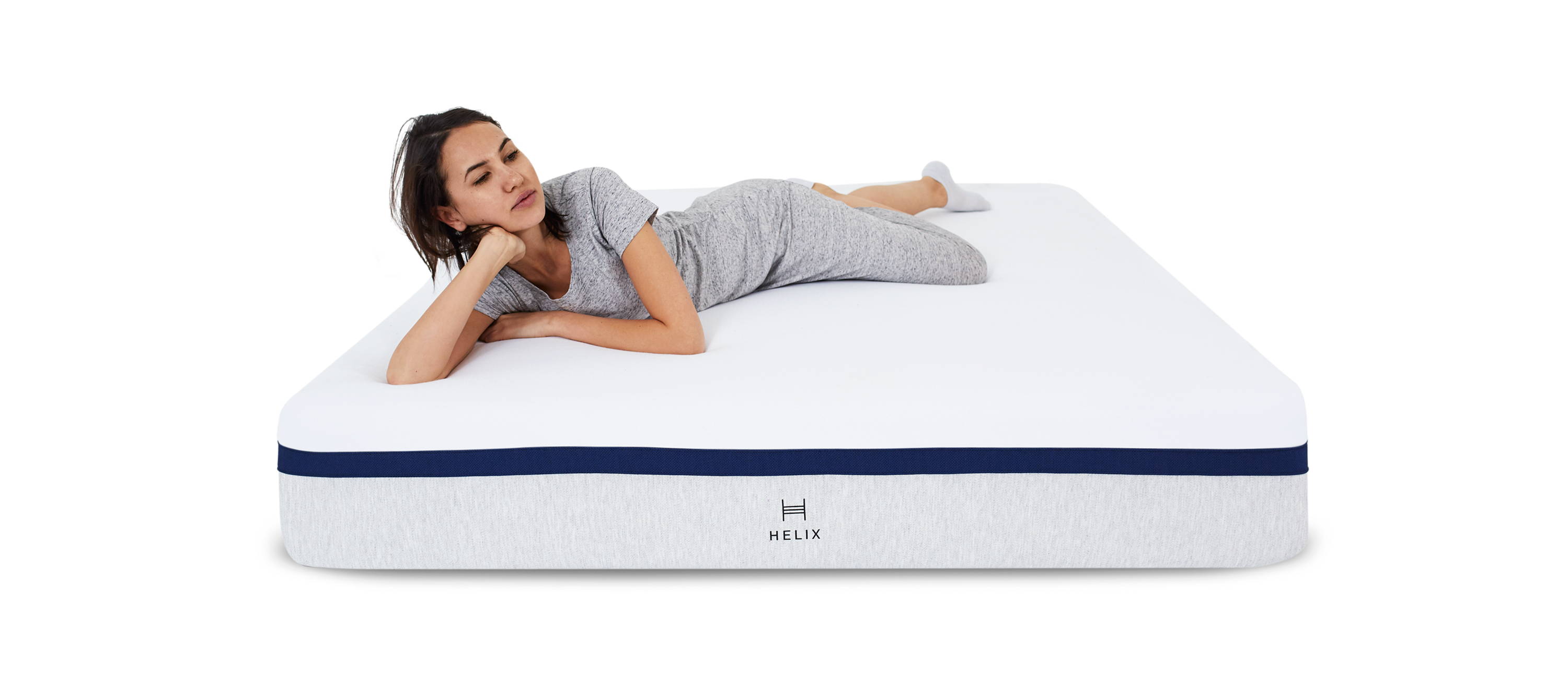 Woman laying on Helix midnight mattress