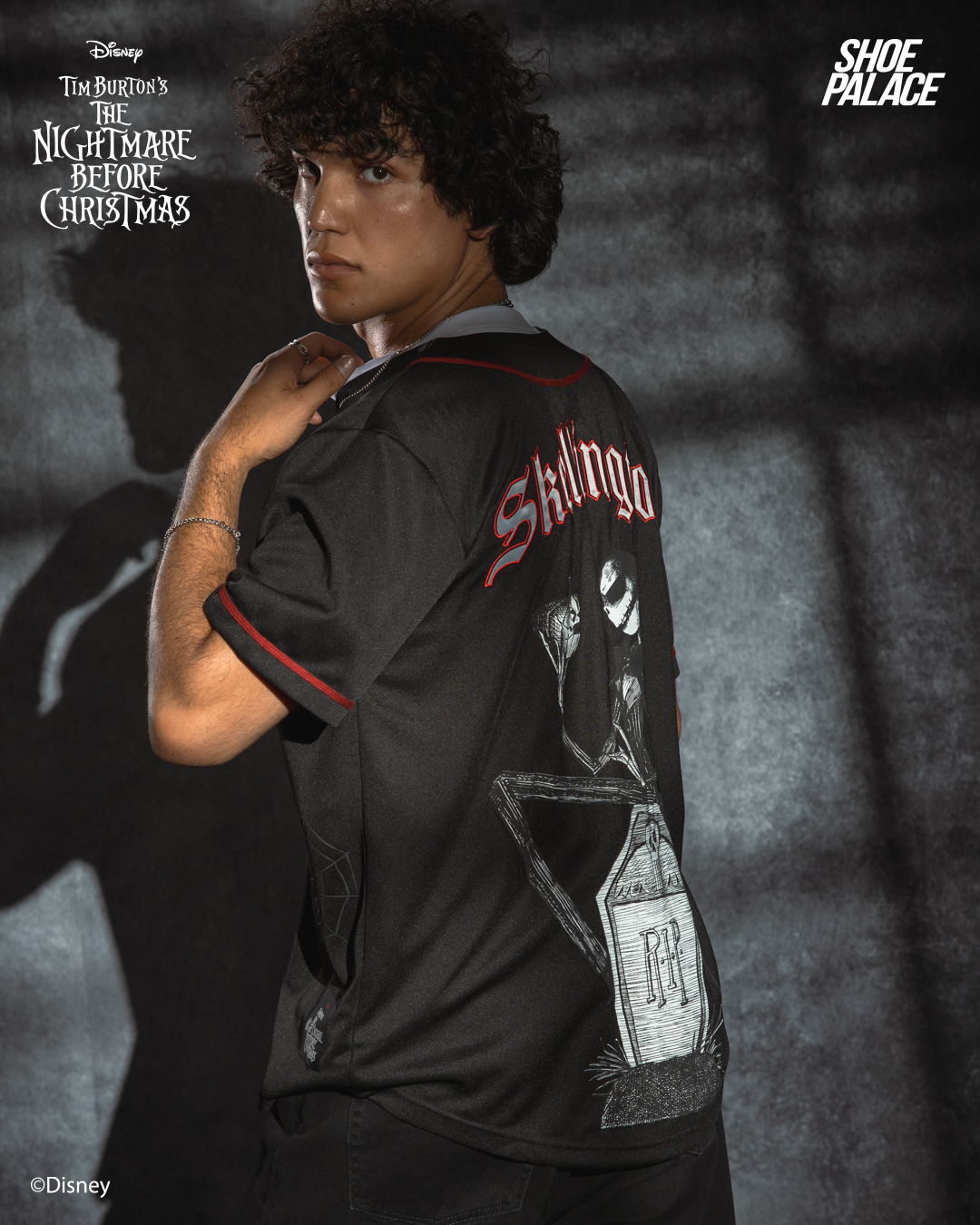 Person wearing a black shirt featuring a character from 