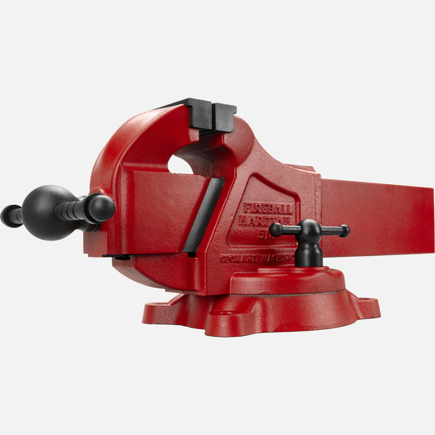 Red bench vise with adjustable jaws and a sturdy base.