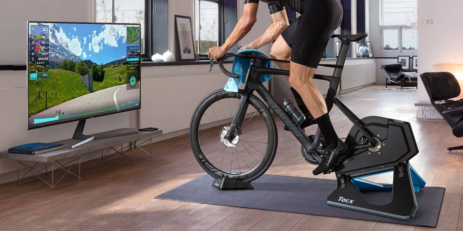 A cyclist using a tacx smart trainer with riding app at indoors