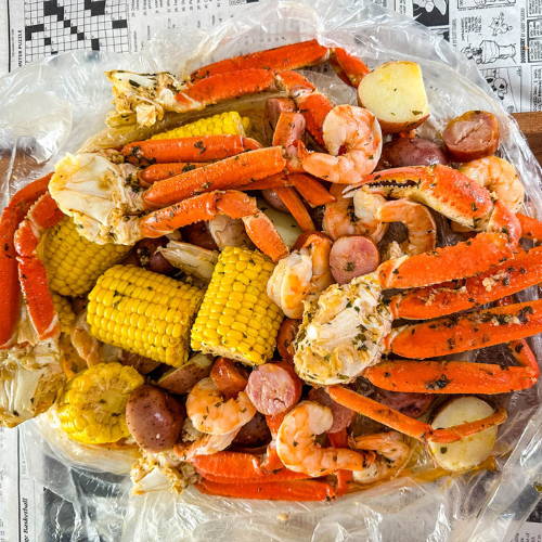 Crab legs with potatoes and sausage