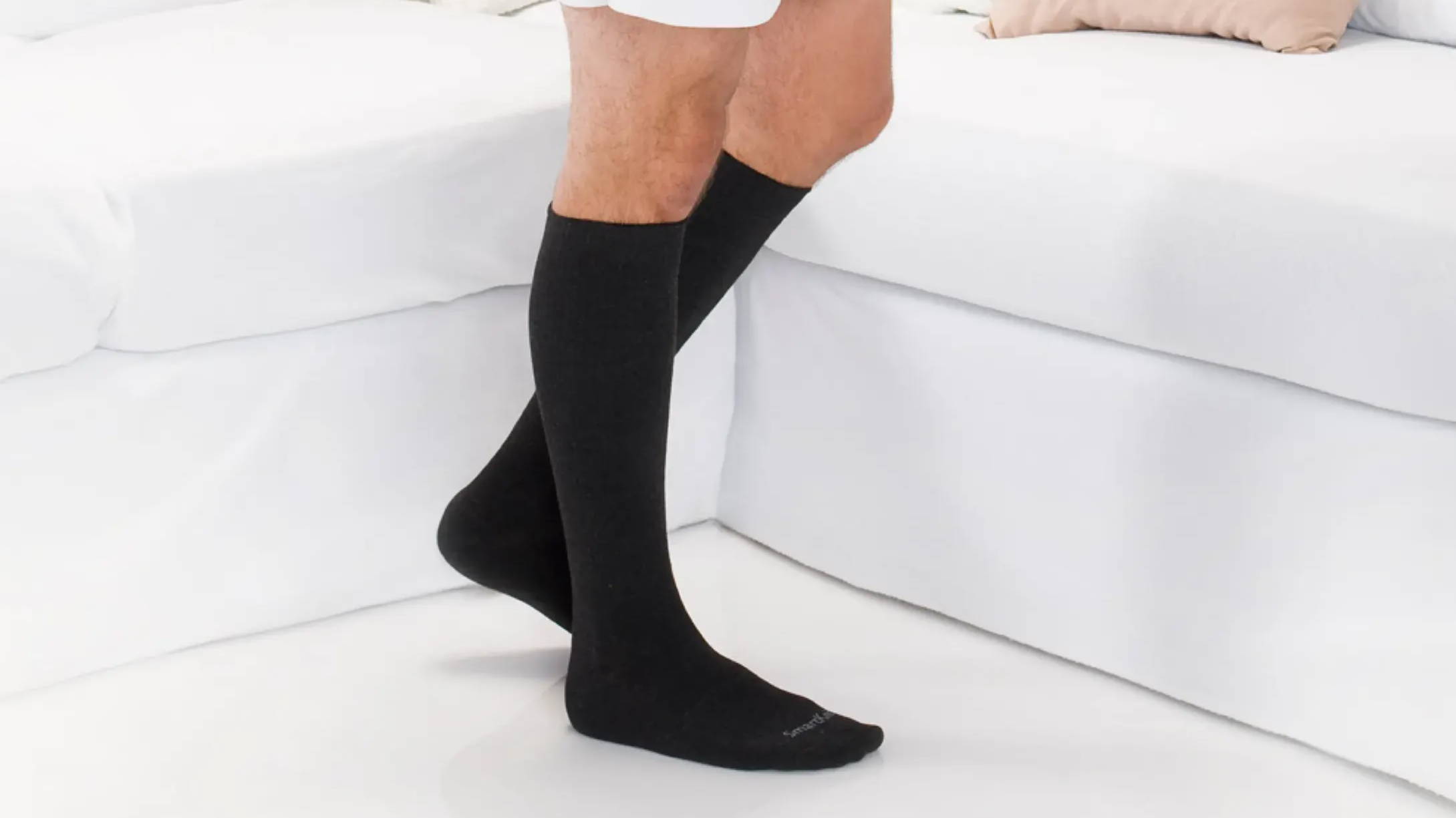 Woman wearing SmartKnit Seamless Socks that reduce pressure points and irritation. Eliminated wrinkling and bunching. Moisture-wicking. Non-binding. Ideal for diabetics.