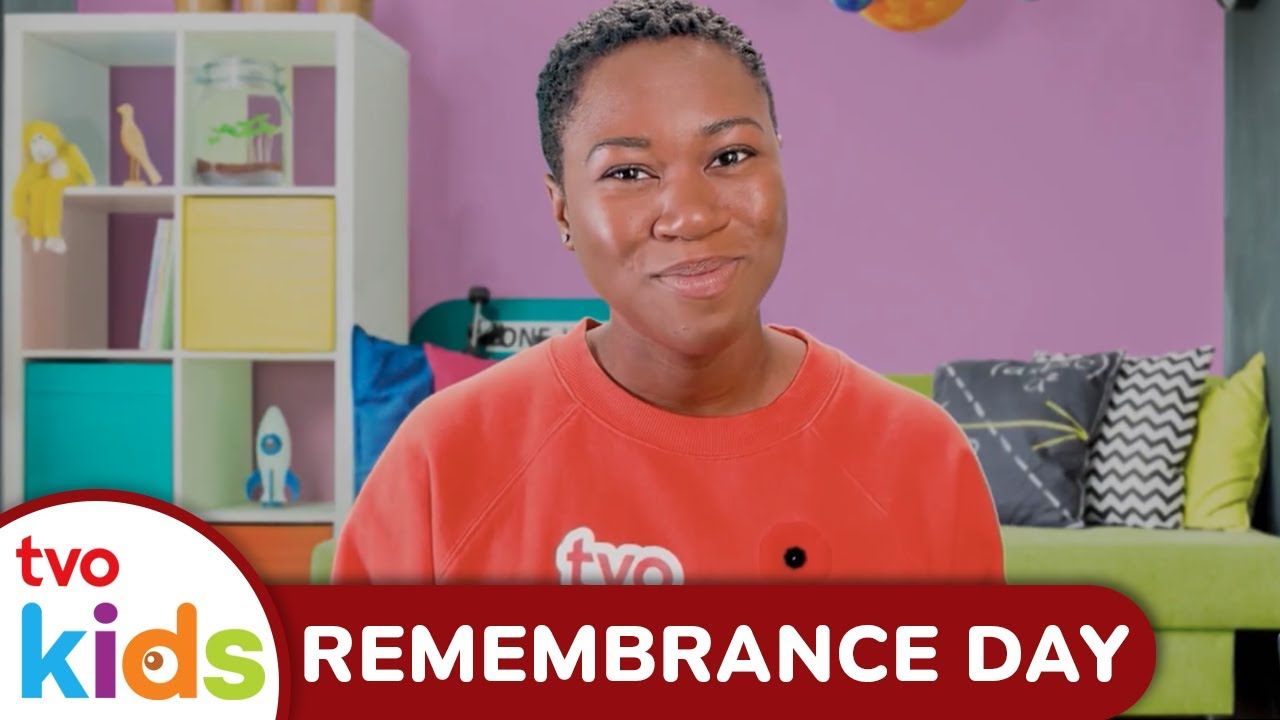 Child smiling in a colorful room, promoting Remembrance Day for kids.