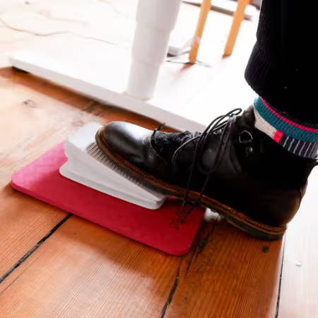 using a pedal mat to control the movement of a sewing machine foot pedal
