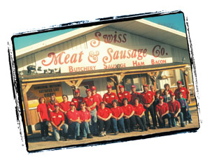 Swiss Meats employees in front of the Swiss Meat & Sausage Company storefront