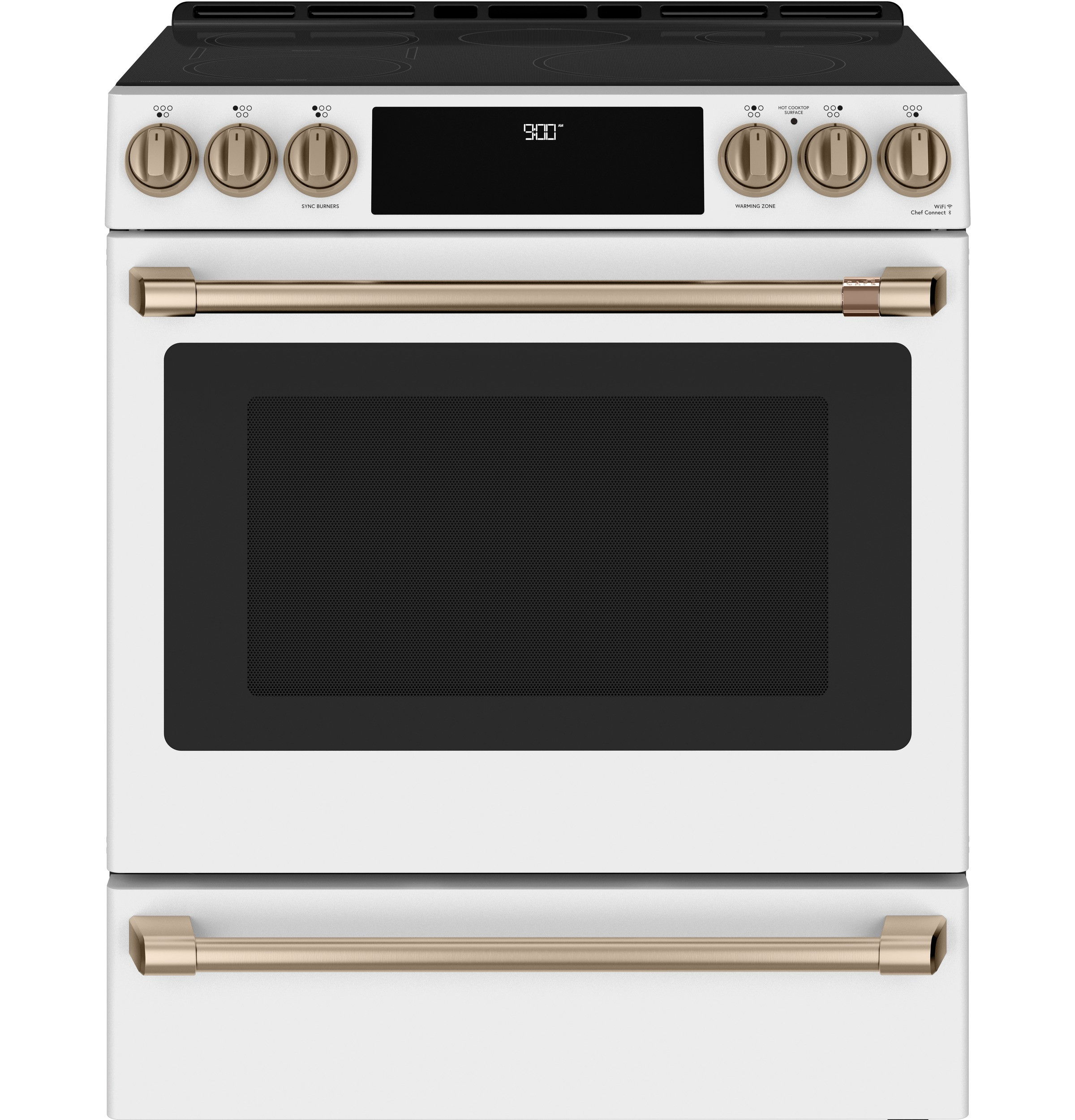 A modern white oven with brass accents and digital display.