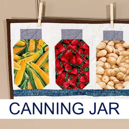 Three different canning jar quilt blocks on a wall hanging