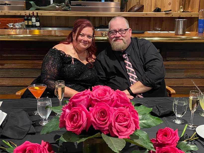 Bride and groom at breast cancer awareness themed wedding