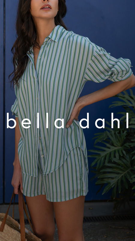 Woman in striped outfit stands beside a plant, text overlay reads 