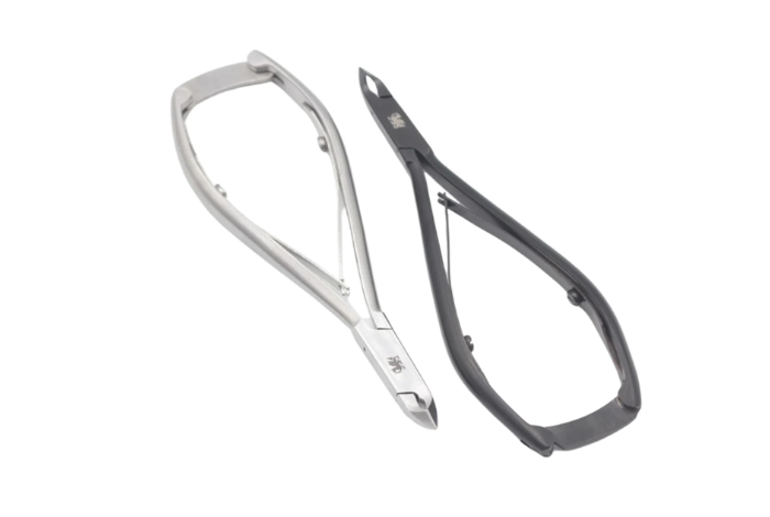 Two pairs of eyeglass frames, one silver and one black.