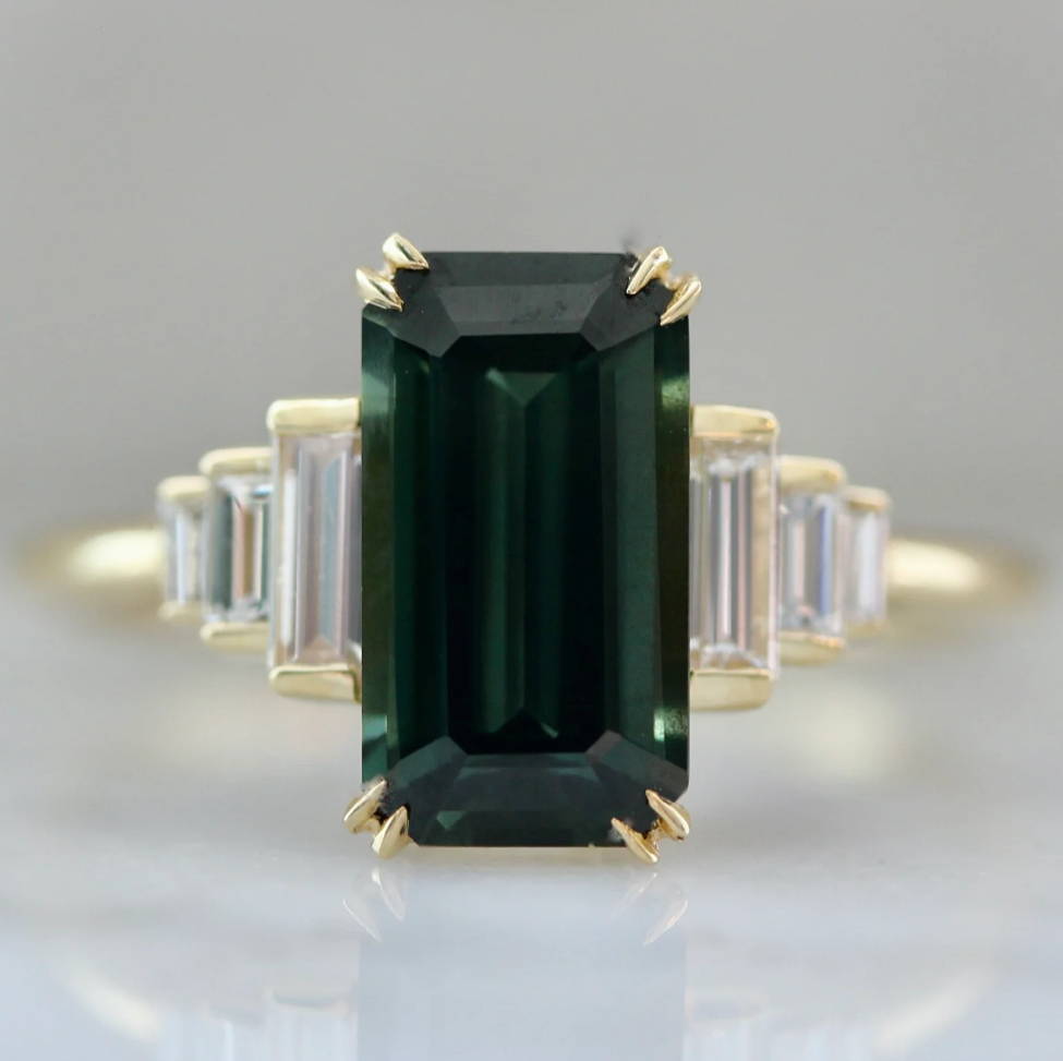 emerald cut sapphire ring with diamond baguette sides
