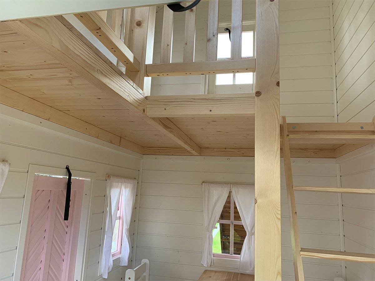 2-Story Outdoor Playhouse Princess inside view with a ladder to upper floor and painted from inside by WholeWoodPlayhouses