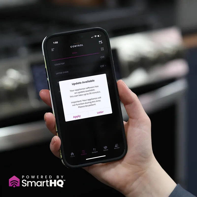 hand holding smartphone, running SmartHQ app, ready for an update.