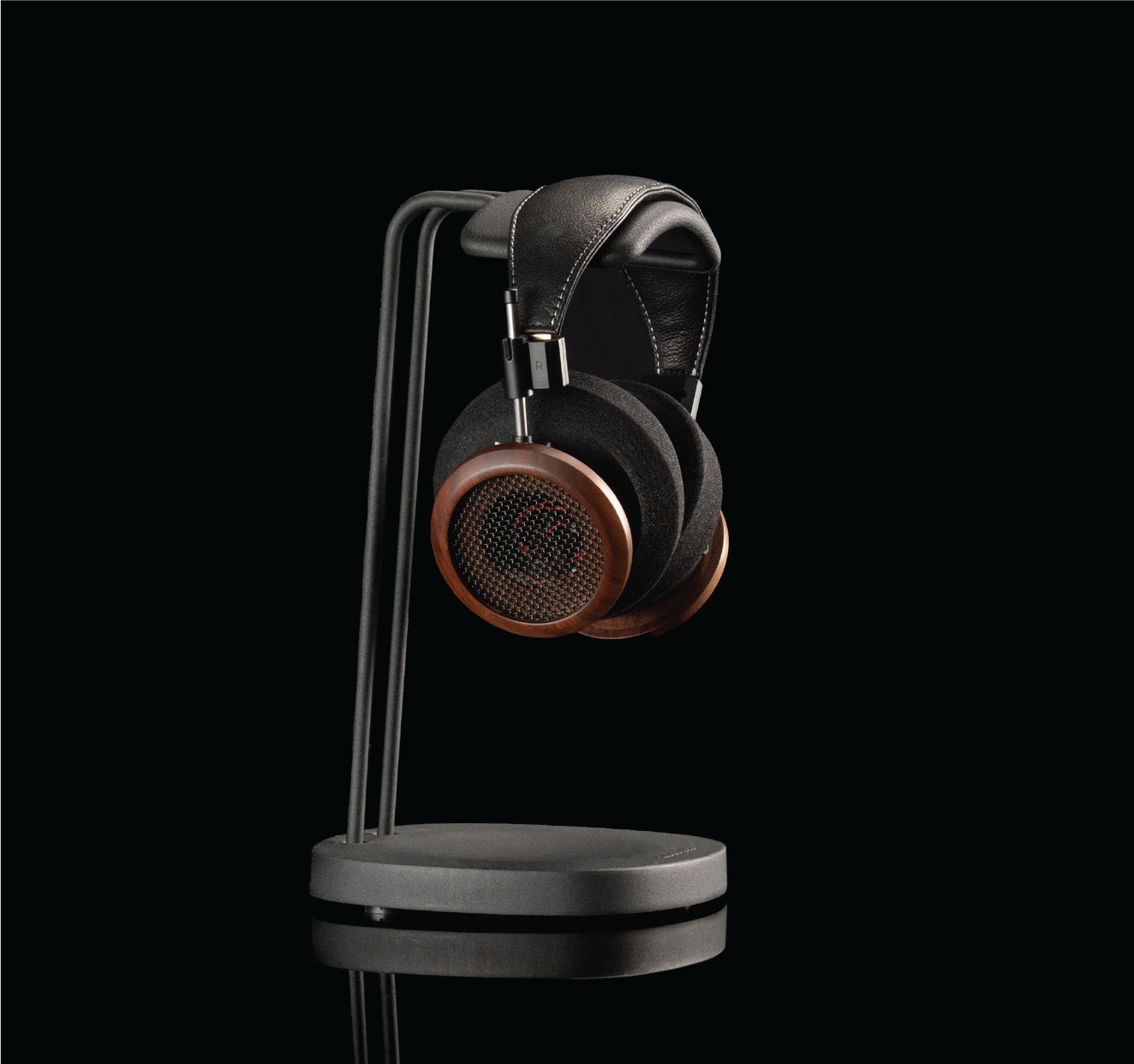 A photo fo the Grado S950 Headphones hanging from a black headphone stand.