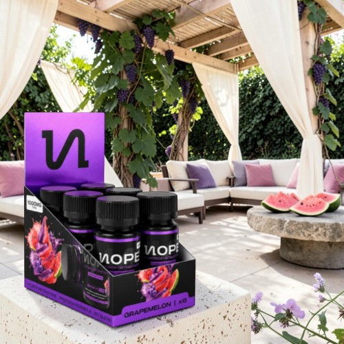 Display of beverage bottles in a stylish outdoor lounge setting.