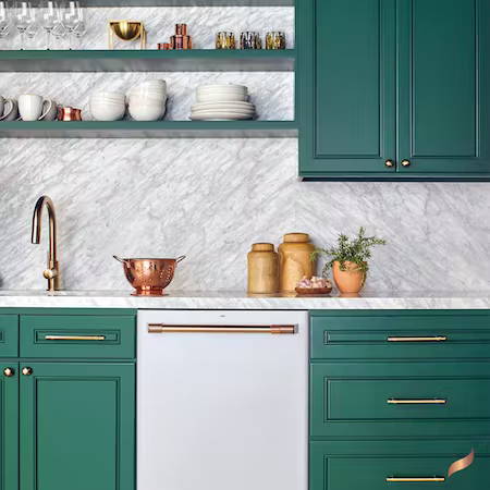 Matte white dishwasher in kitchen with bright green cabinets