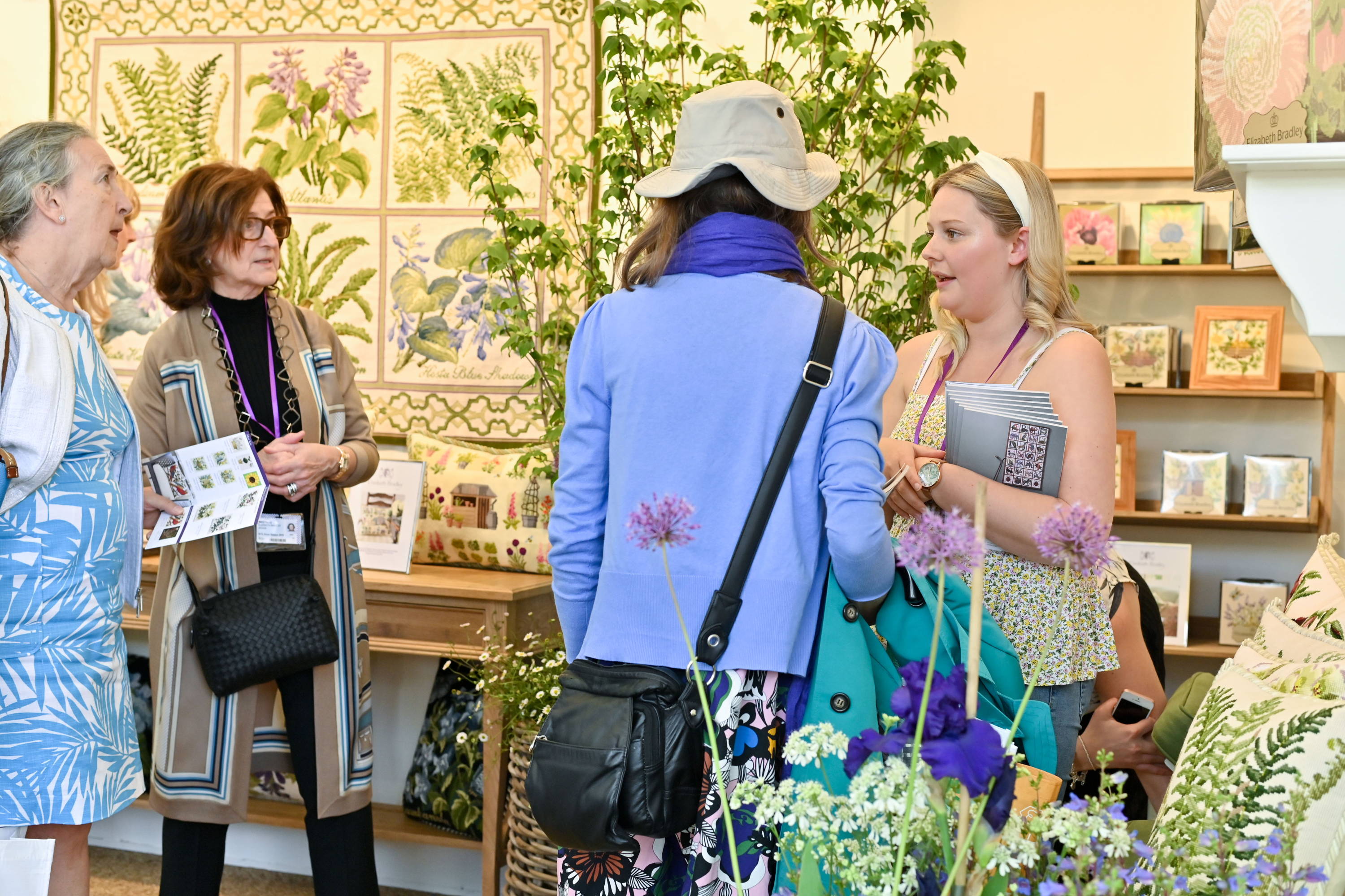 Customers being helped at the Elizabeth Bradley Chelsea Flower show booth