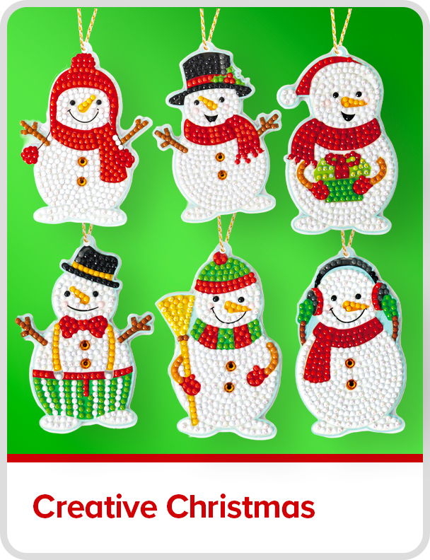 Colorful snowman decorations for Christmas on a green background. Creative Christmas