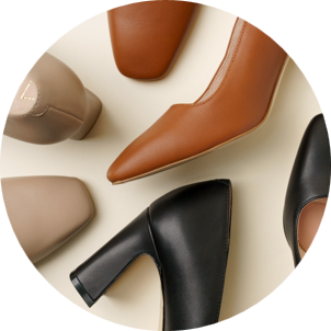 Various high-heeled shoes in brown, beige, and black colors arranged on a surface.