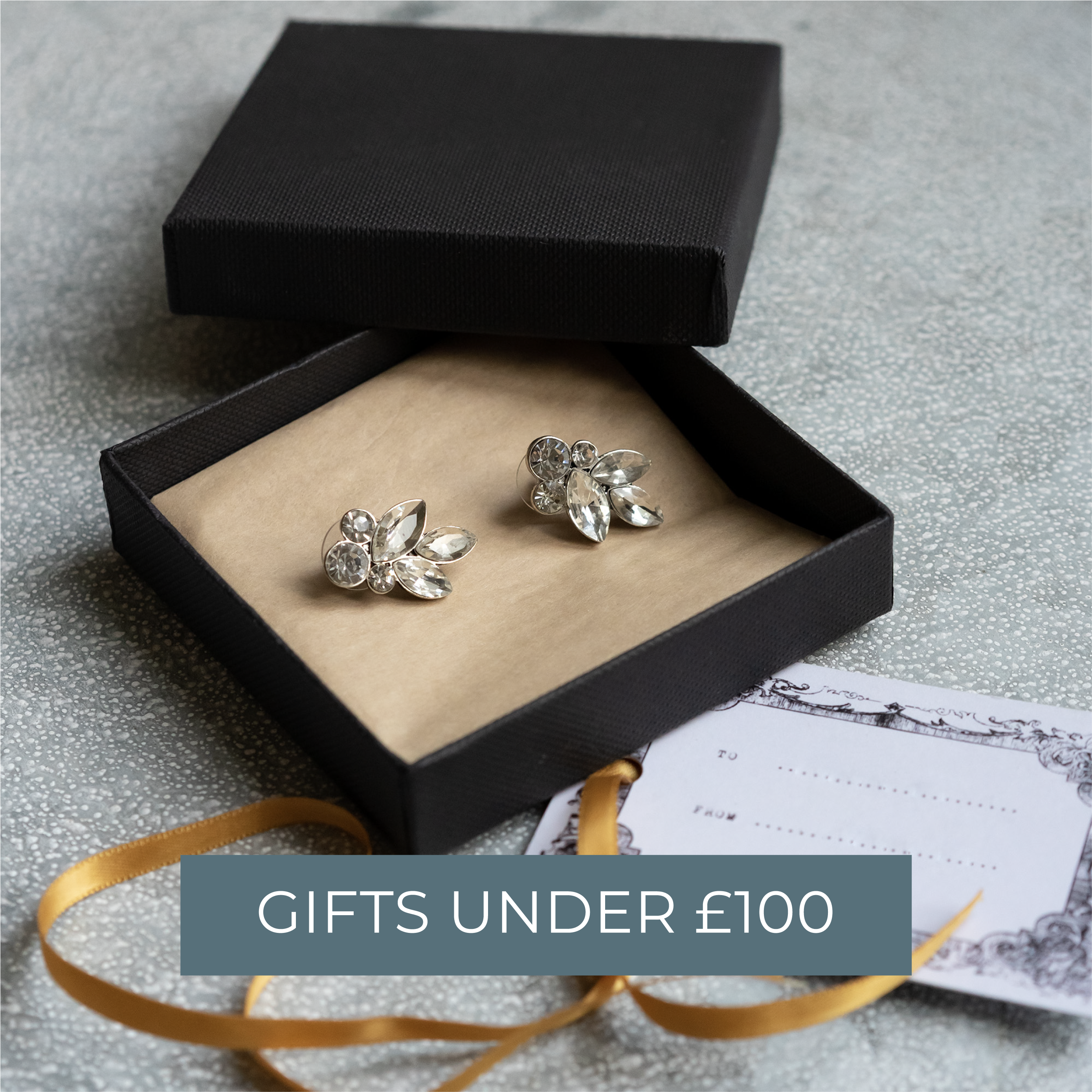 A pair of crystal earrings in a black gift box