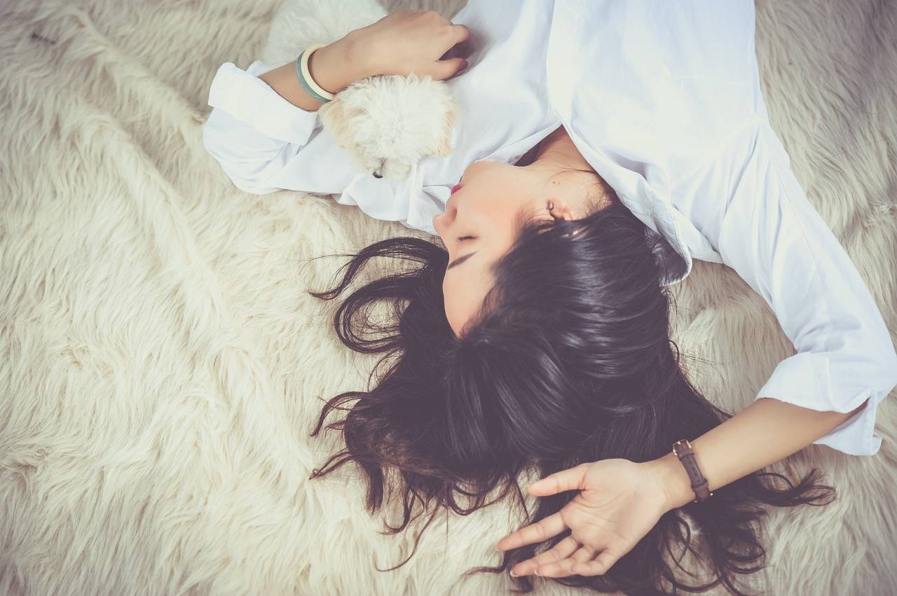 Woman Sleeping On A Rug